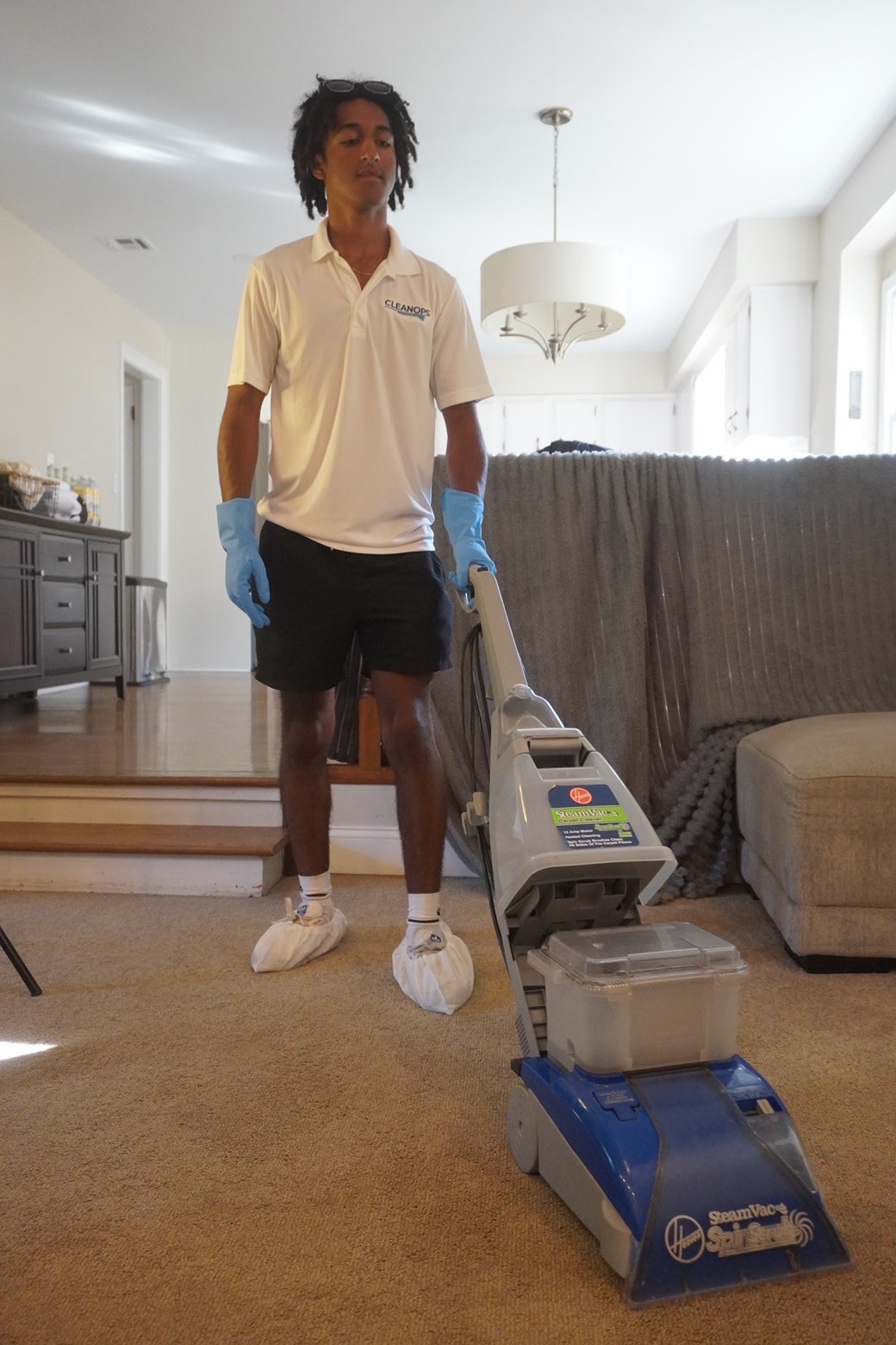 Clean Ops Solutions team member deep cleaning carpets in a Doylestown, PA home